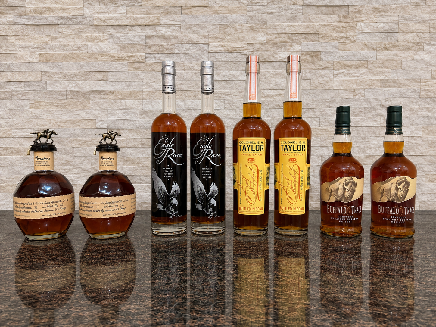 Collection of eight Buffalo Trace bourbons including Blanton's, Eagle Rare, E.H. Taylor, and Buffalo Trace